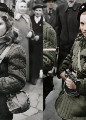 En ung person iförd pälsmössa, en grön jacka med en grön väska över axeln tittar in i kameran med ett vapen i händerna.